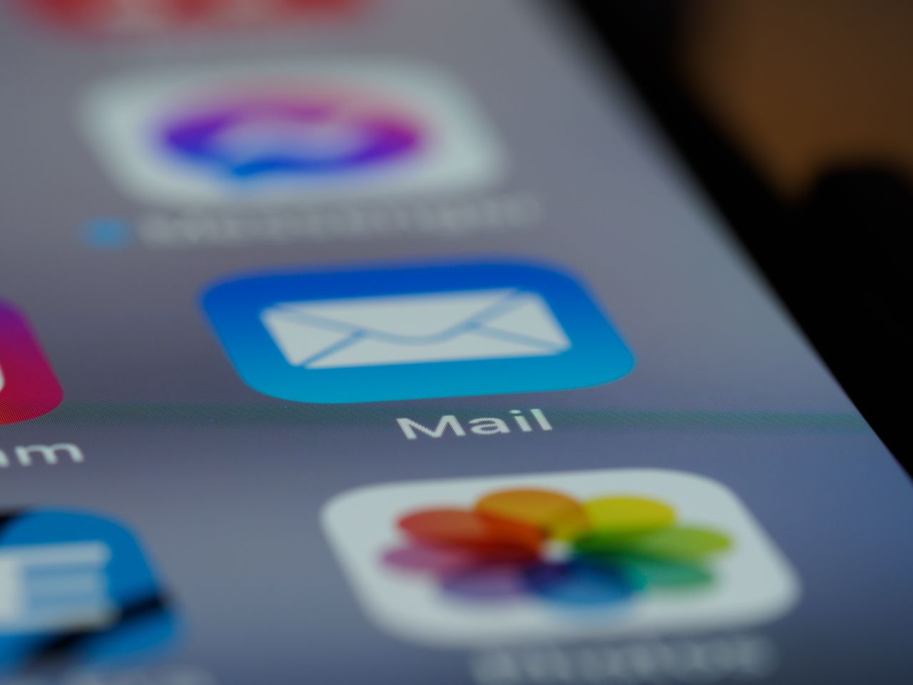 who-we-are Detailed close-up of an email app icon on a smartphone screen, showcasing modern technology.